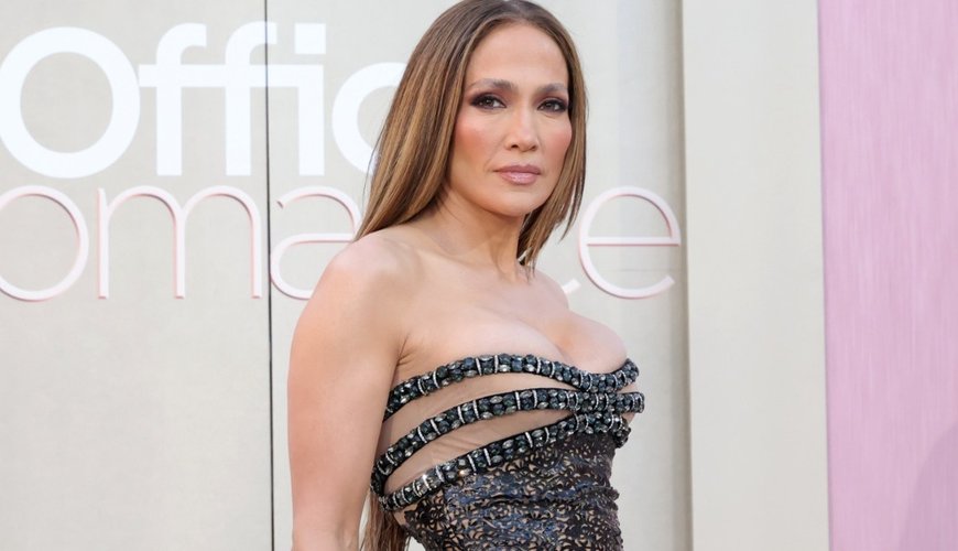 J.Lo Dazzles in Vintage Versace at 'Office Romance' Premiere