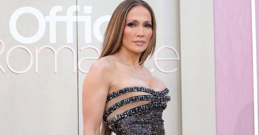J.Lo Dazzles in Vintage Versace at 'Office Romance' Premiere